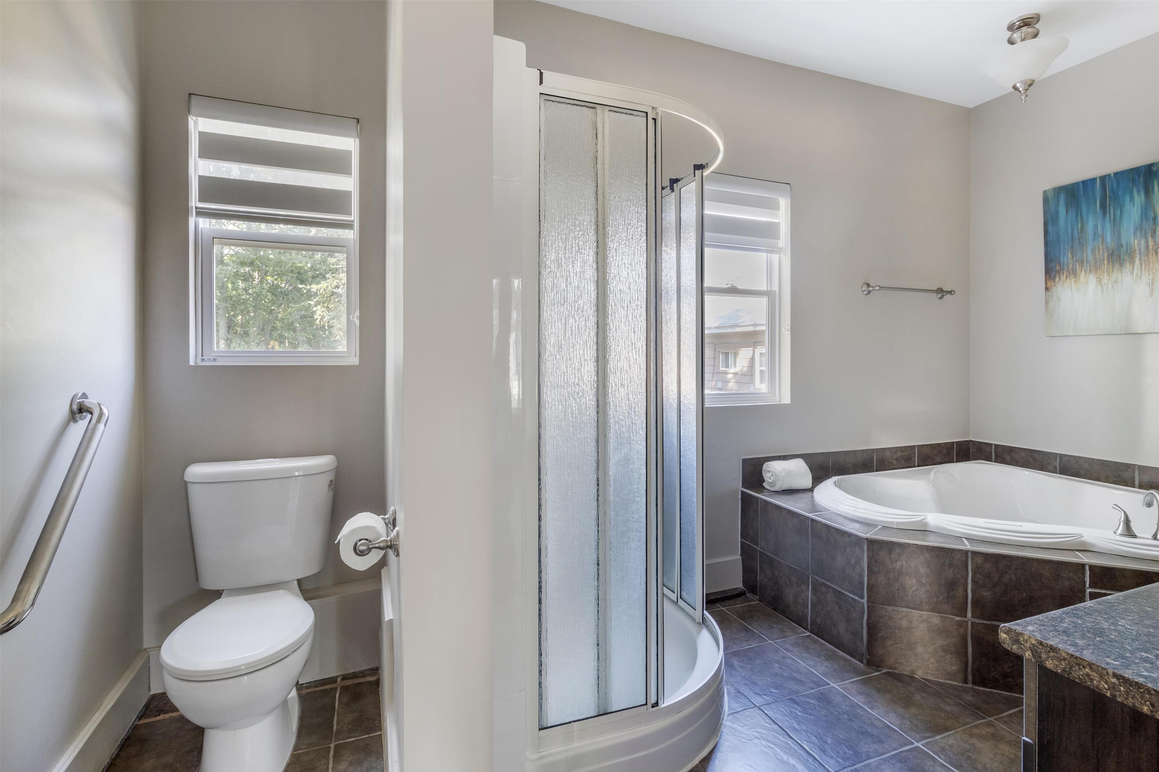 suite, 1 king bed with sofa bed, non smoking, jetted tub (with sofabed) | bathroom | combined shower/bathtub, free toiletries, hair dryer, towels