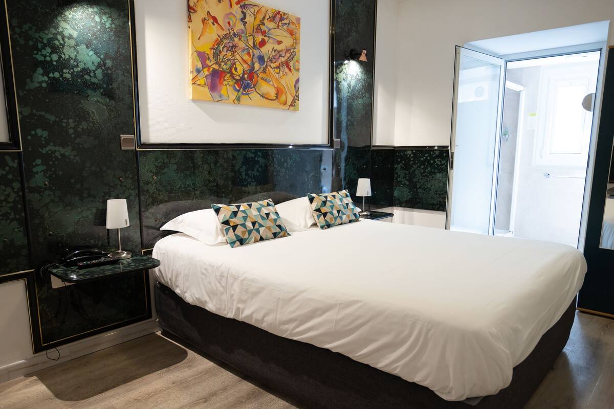 junior suite, 1 queen bed, private bathroom | premium bedding, desk, soundproofing, iron/ironing board