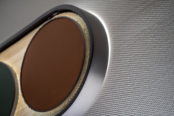 A close-up of a textured surface with a circular, oval-shaped object.