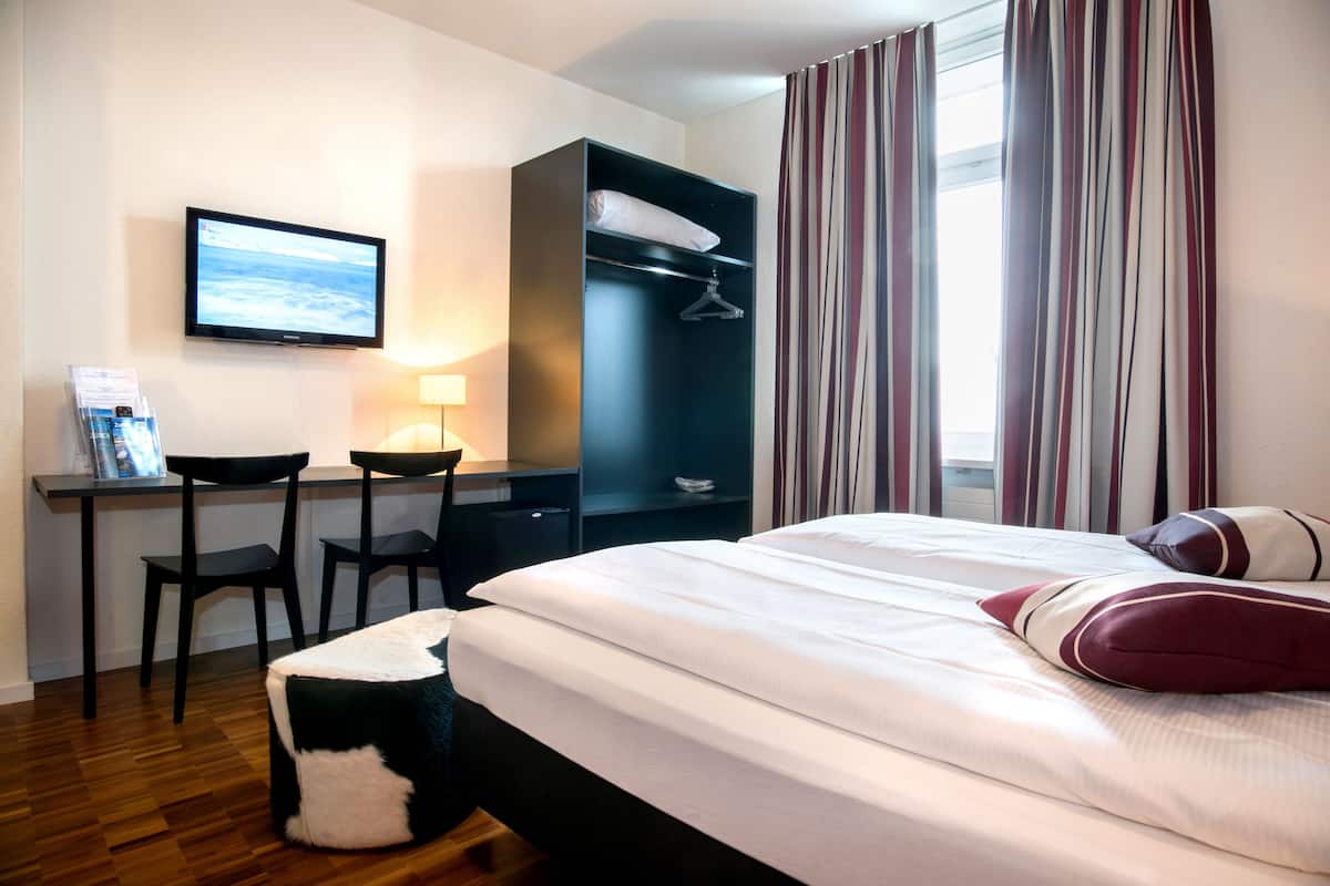 Hypo-allergenic bedding, down duvets, laptop workspace