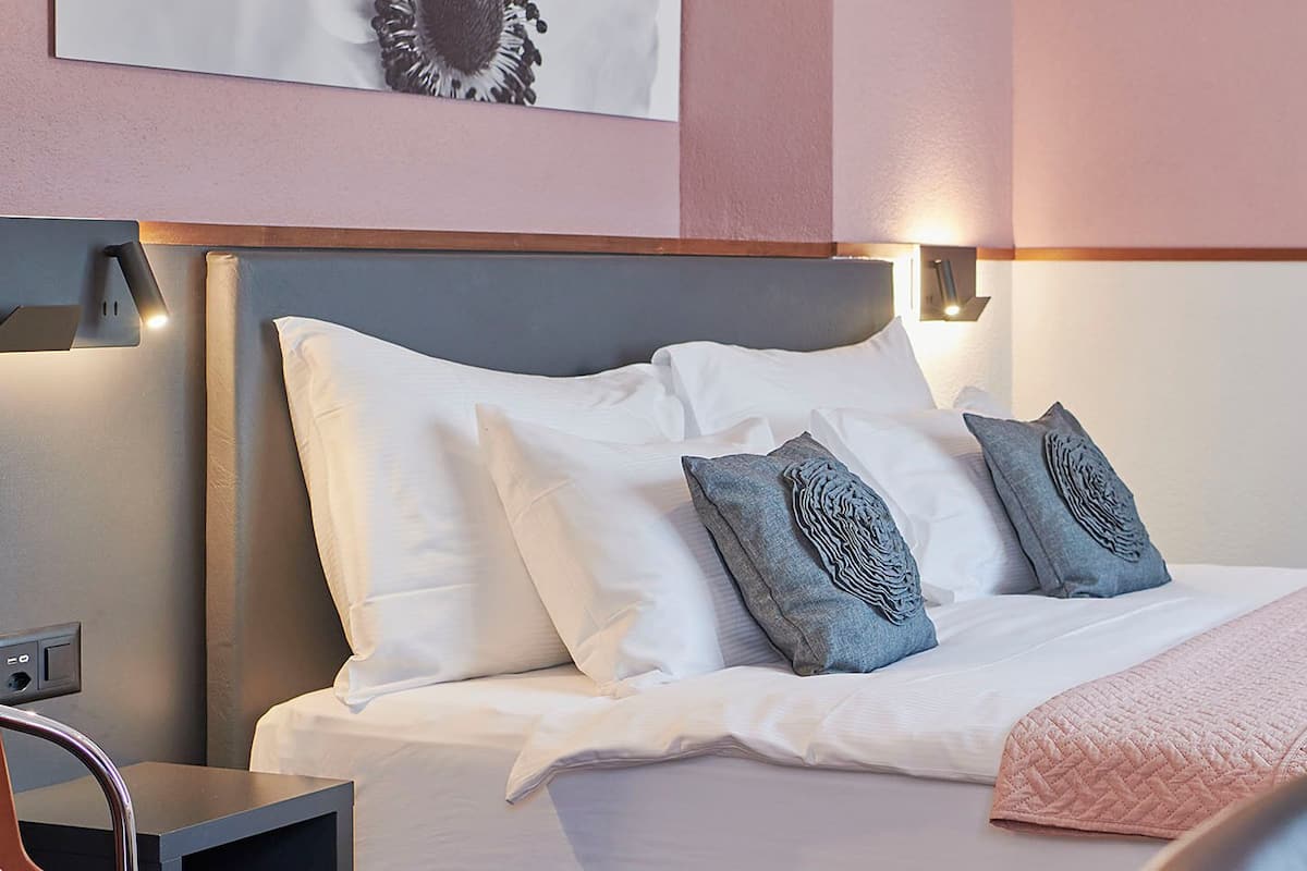 Hypo-allergenic bedding, down duvets, laptop workspace