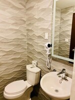 Spring water tub, rainfall showerhead, designer toiletries, hair dryer