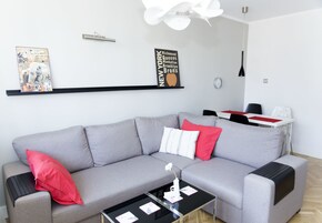 Deluxe-huoneisto, 1 makuuhuone, parveke, kaupunkinäköala | Oleskelualue | Taulutelevisio
