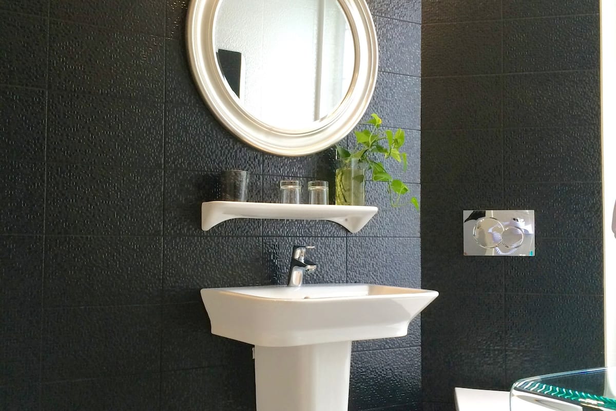 deluxe double room, 1 queen bed | bathroom | shower, free toiletries, hair dryer, towels