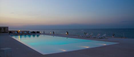 Seasonal outdoor pool, pool umbrellas, sun loungers