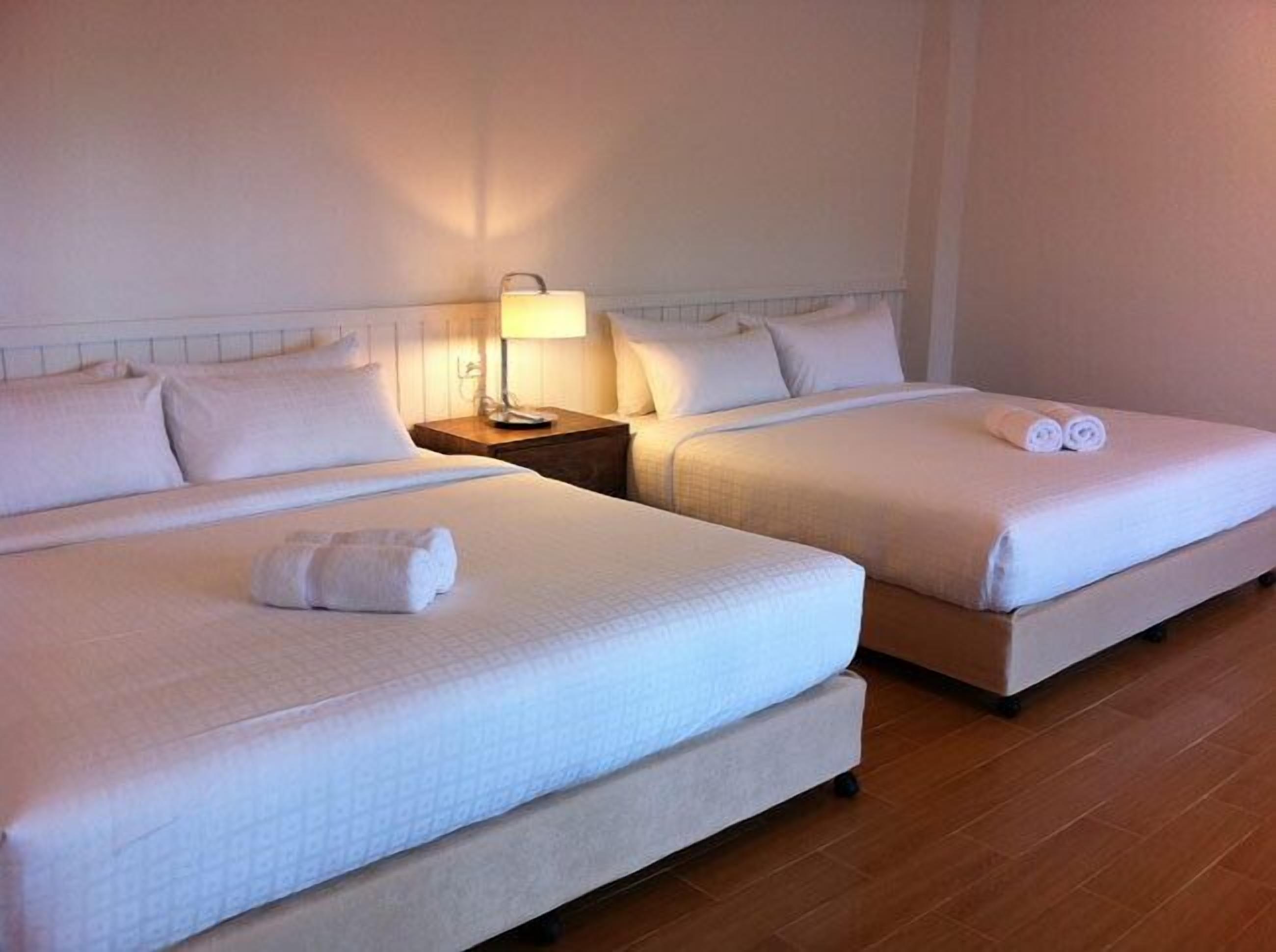 family room | minibar, in-room safe, desk, blackout curtains