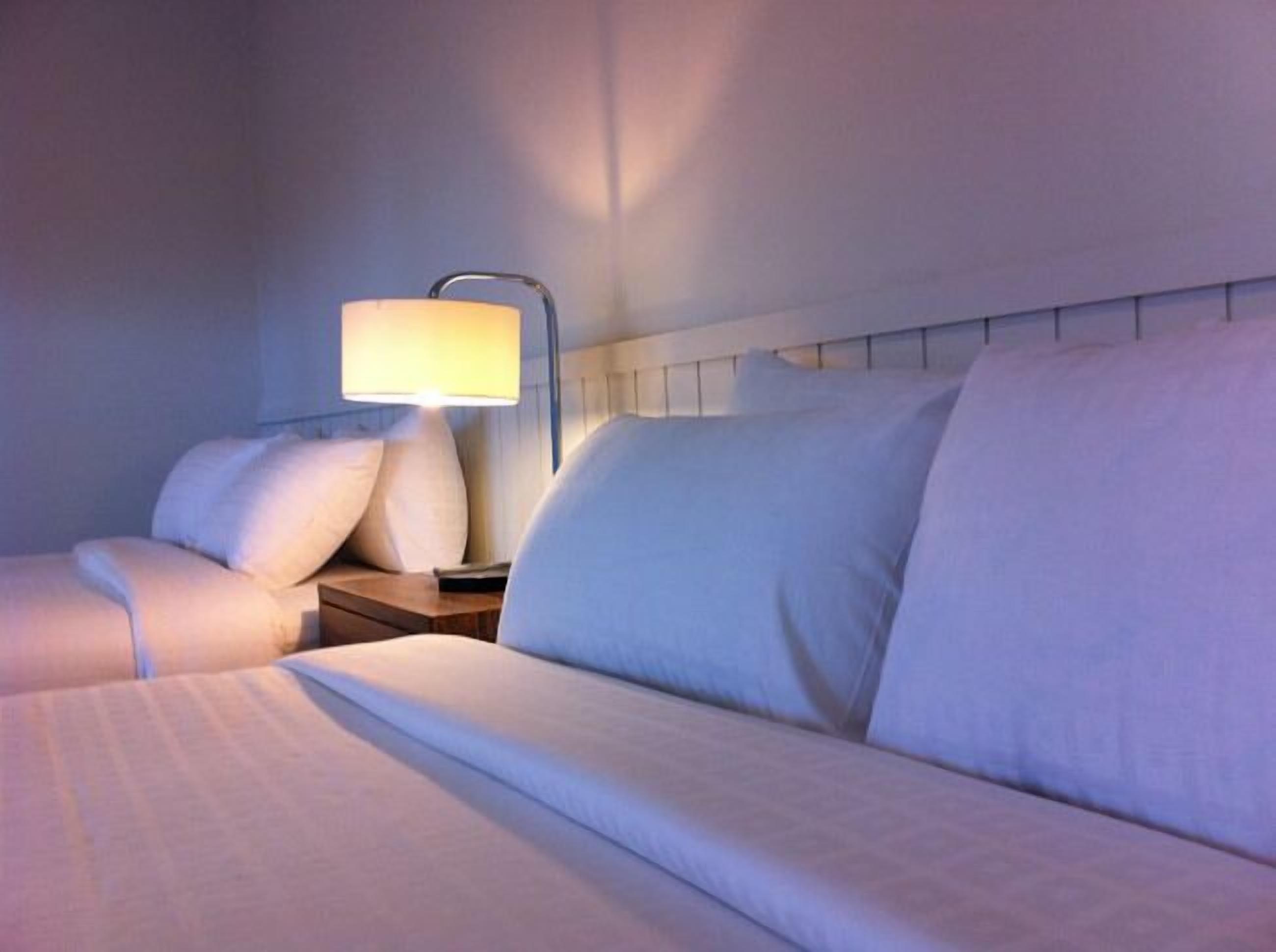 family room | minibar, in-room safe, desk, blackout curtains