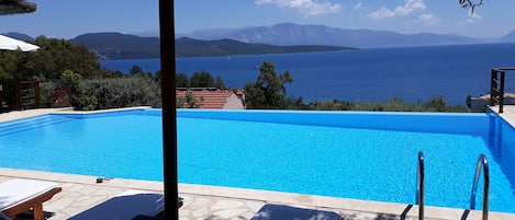 Seasonal outdoor pool, open 9 AM to 9 PM, pool umbrellas, sun loungers