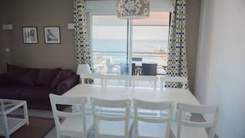 Apartment, 1 Bedroom | Living area | 57-cm flat-screen TV with digital channels, TV