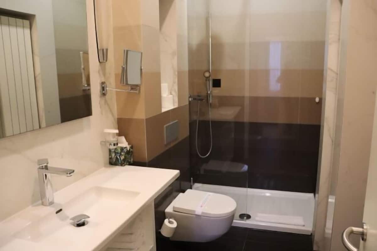 Bathroom | Shower, hair dryer, bathrobes, slippers