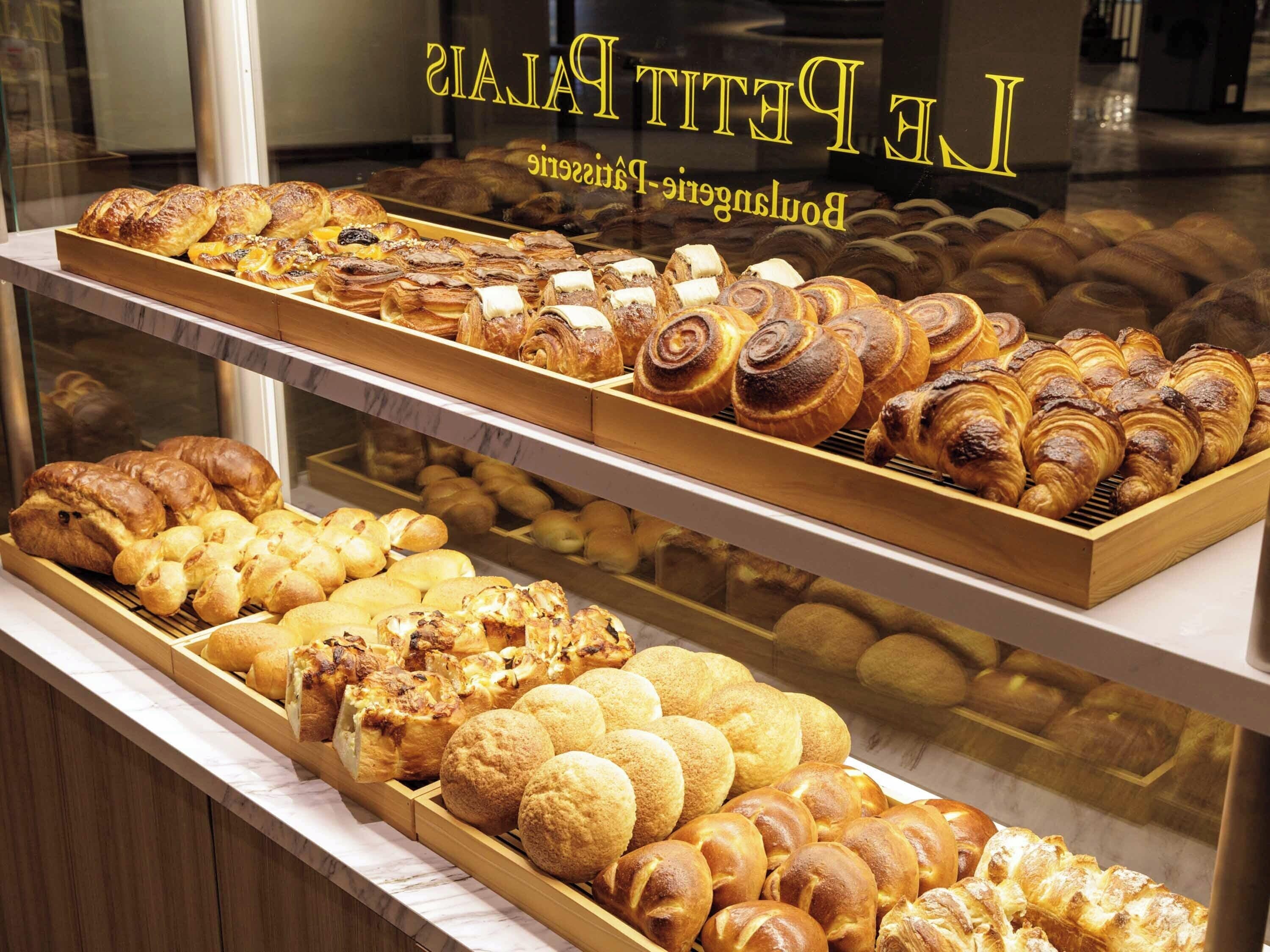 A bakery display case with various baked goods.