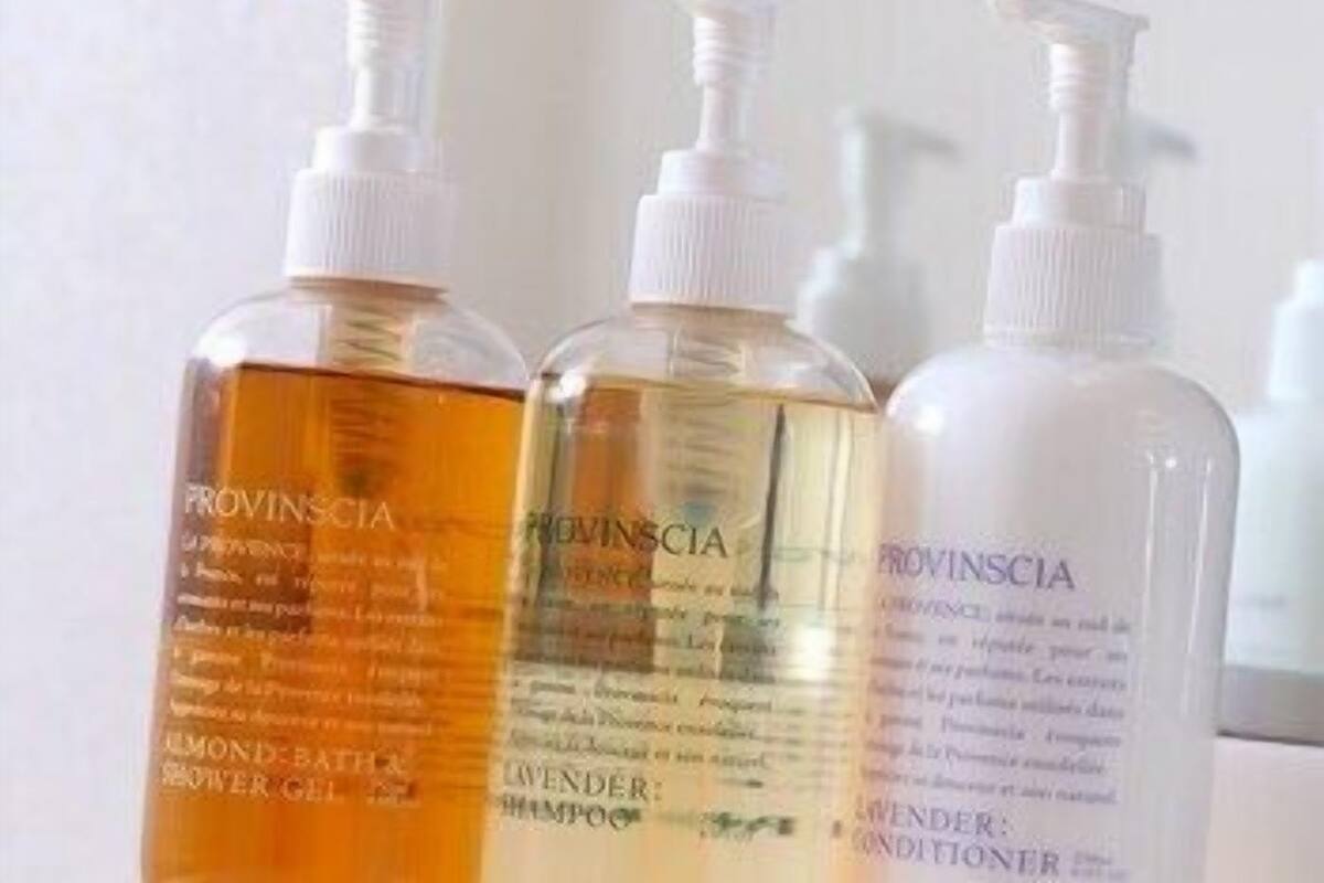 Three bottles of Provinscia products: a shower gel, a shampoo, and a conditioner.