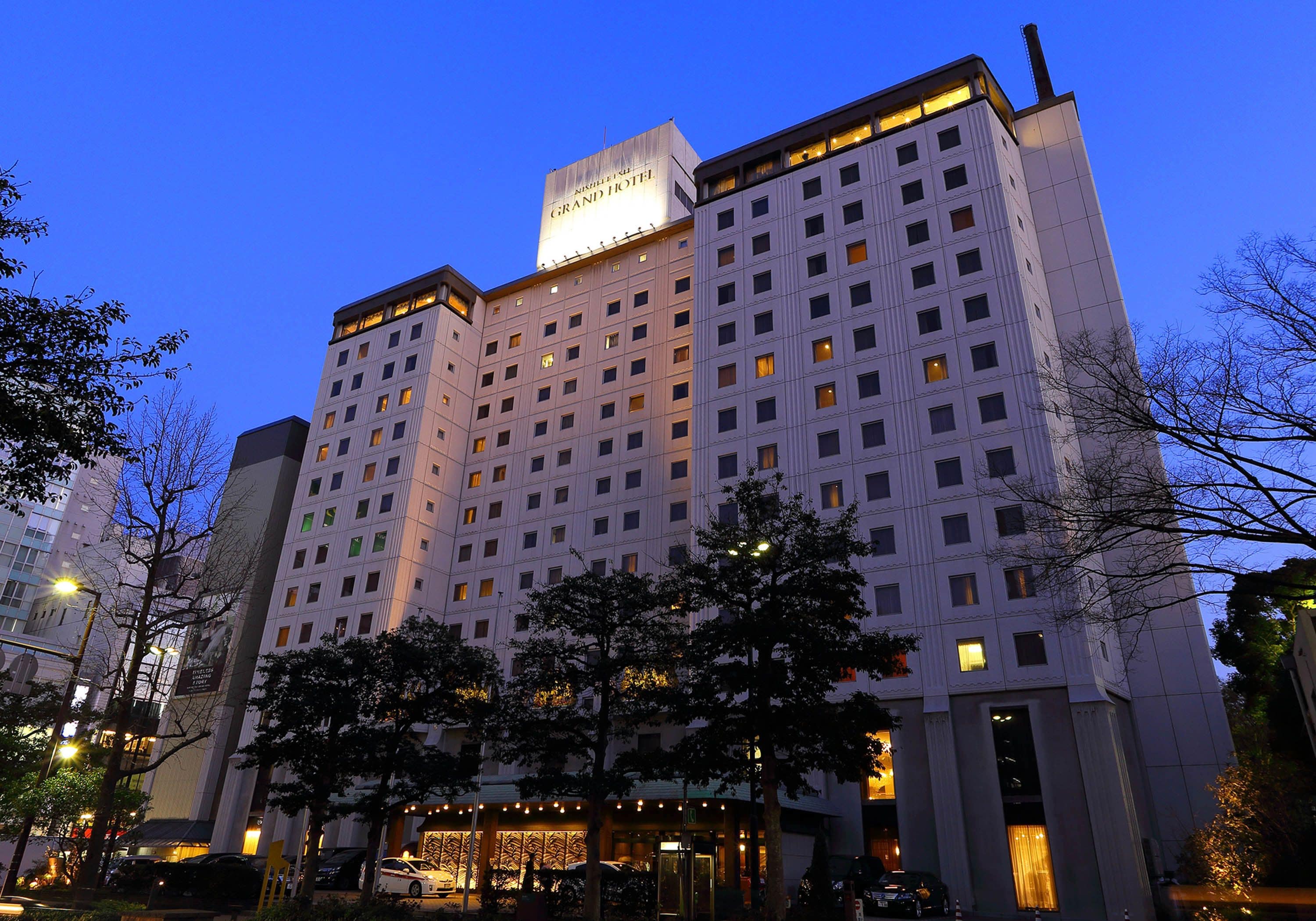 A multi-story hotel with a prominent sign at the top.
