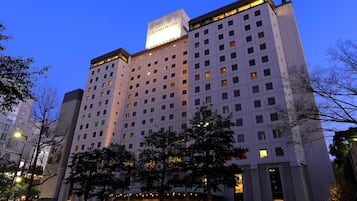 A multi-story hotel with a prominent sign at the top.