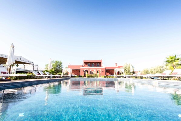 2 outdoor pools, pool umbrellas, pool loungers