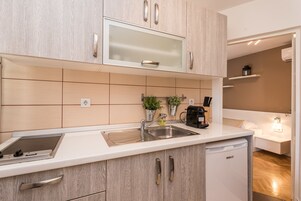 Apartment, 1 Bedroom | Private kitchen | Fridge, stovetop, coffee/tea maker, electric kettle