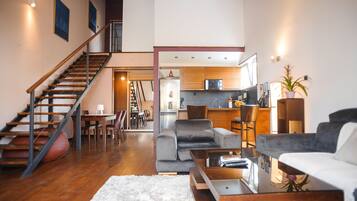 Comfort Penthouse, 3 Bedrooms, 2 Bathrooms | Living area | 17-inch flat-screen TV with cable channels, TV