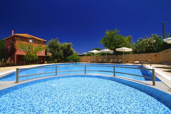 Seasonal outdoor pool, pool umbrellas, sun loungers