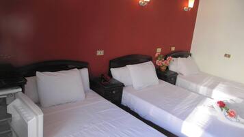 Senior Triple Room, 3 Single Beds, Garden View | In-room safe, desk, iron/ironing board, free cots/infant beds