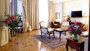 A spacious living room with a large window, a television, and a dining area. - Moskva (Belgrade)