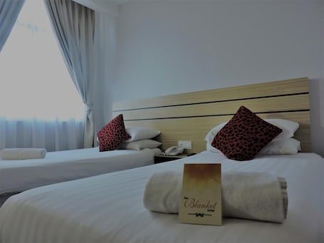 Minibar, in-room safe, desk, iron/ironing board. The Blanket Hotel
