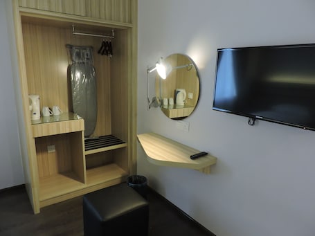 Minibar, in-room safe, desk, iron/ironing board. The Blanket Hotel