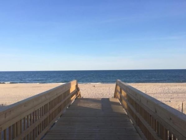 Beach nearby, white sand, sun loungers, beach umbrellas