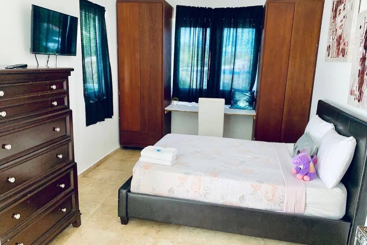 MwPi 201 Deluxe Balcony Suite with 1 Full Size Bed Second Floor | Premium bedding, down comforters, WiFi (free), bed sheets