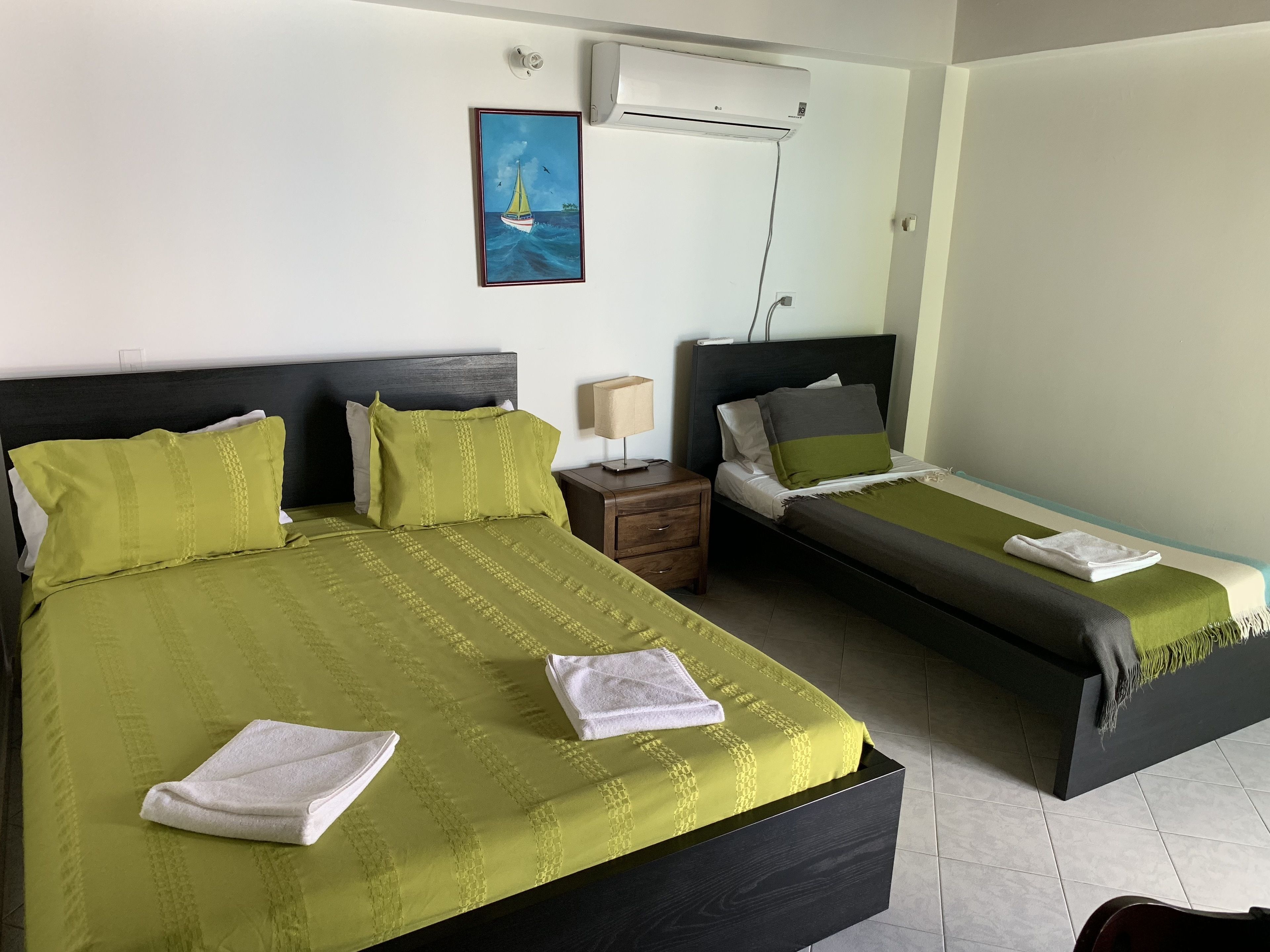twin room, 2 single beds, partial ocean view | in-room safe, desk, bed sheets