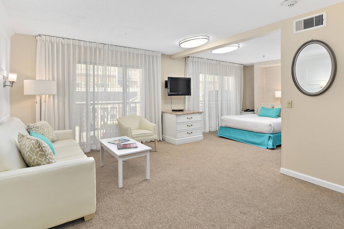 studio, 1 queen bed with sofa bed | living room | 50-inch smart tv with cable channels, tv, streaming services