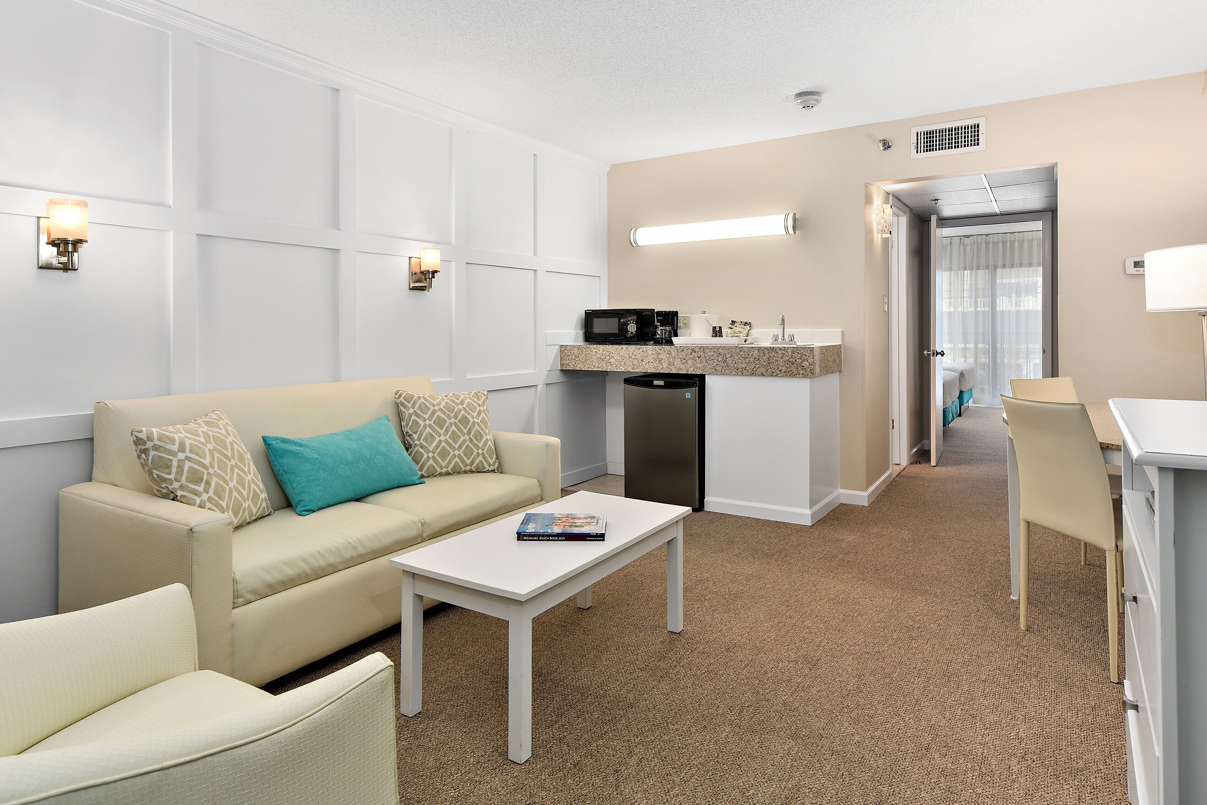 suite, 2 double beds | living room | 50-inch smart tv with cable channels, tv, streaming services