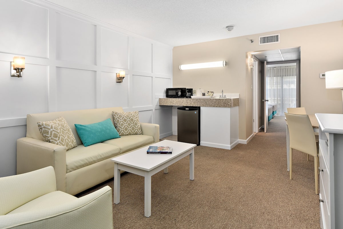 suite, 2 double beds | living room | 50-inch smart tv with cable channels, tv, streaming services