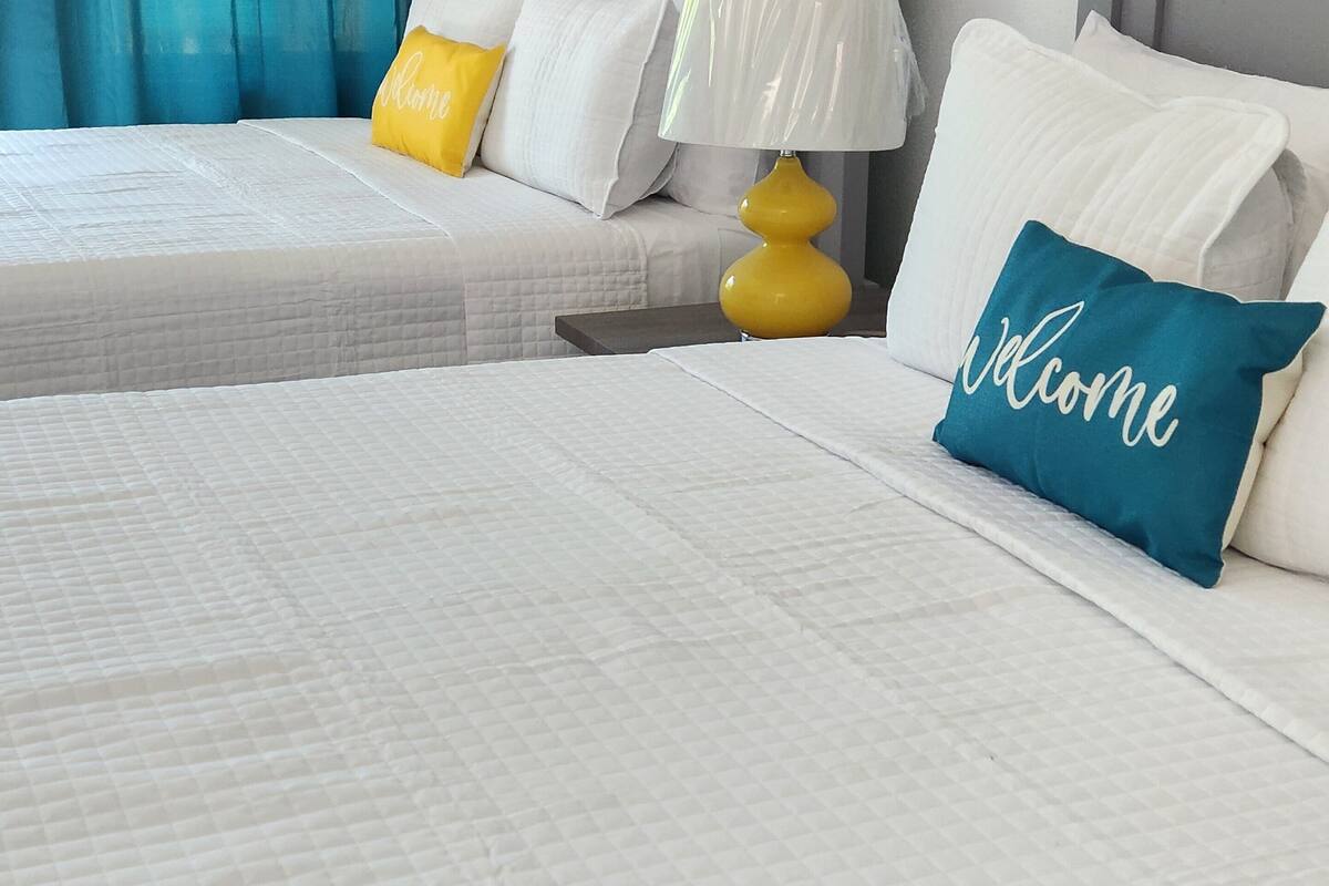 deluxe double room, 2 queen beds, garden view | beach/ocean view