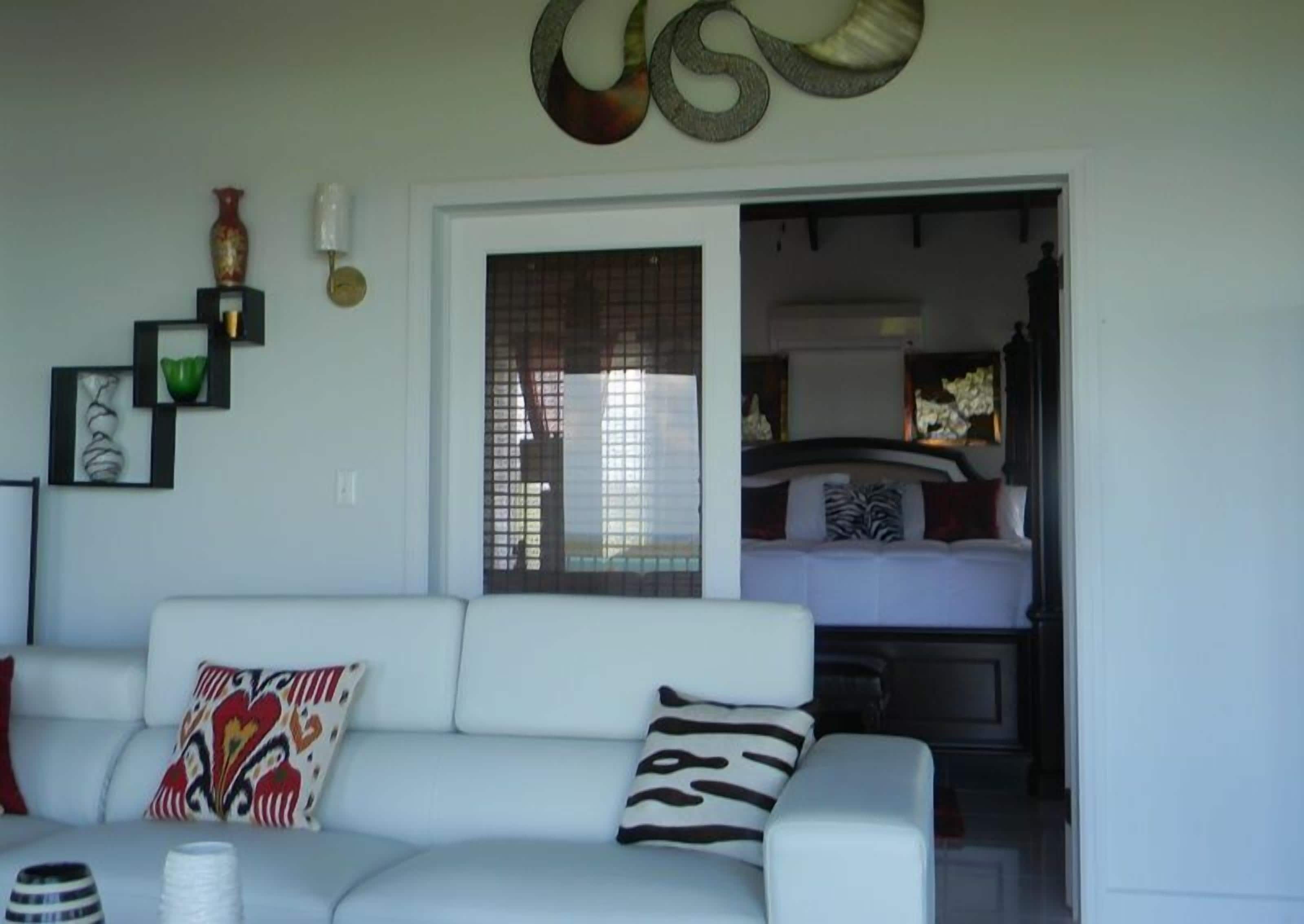 luxury villa, ocean view | living area | 55-inch flat-screen tv with satellite channels, tv, computer