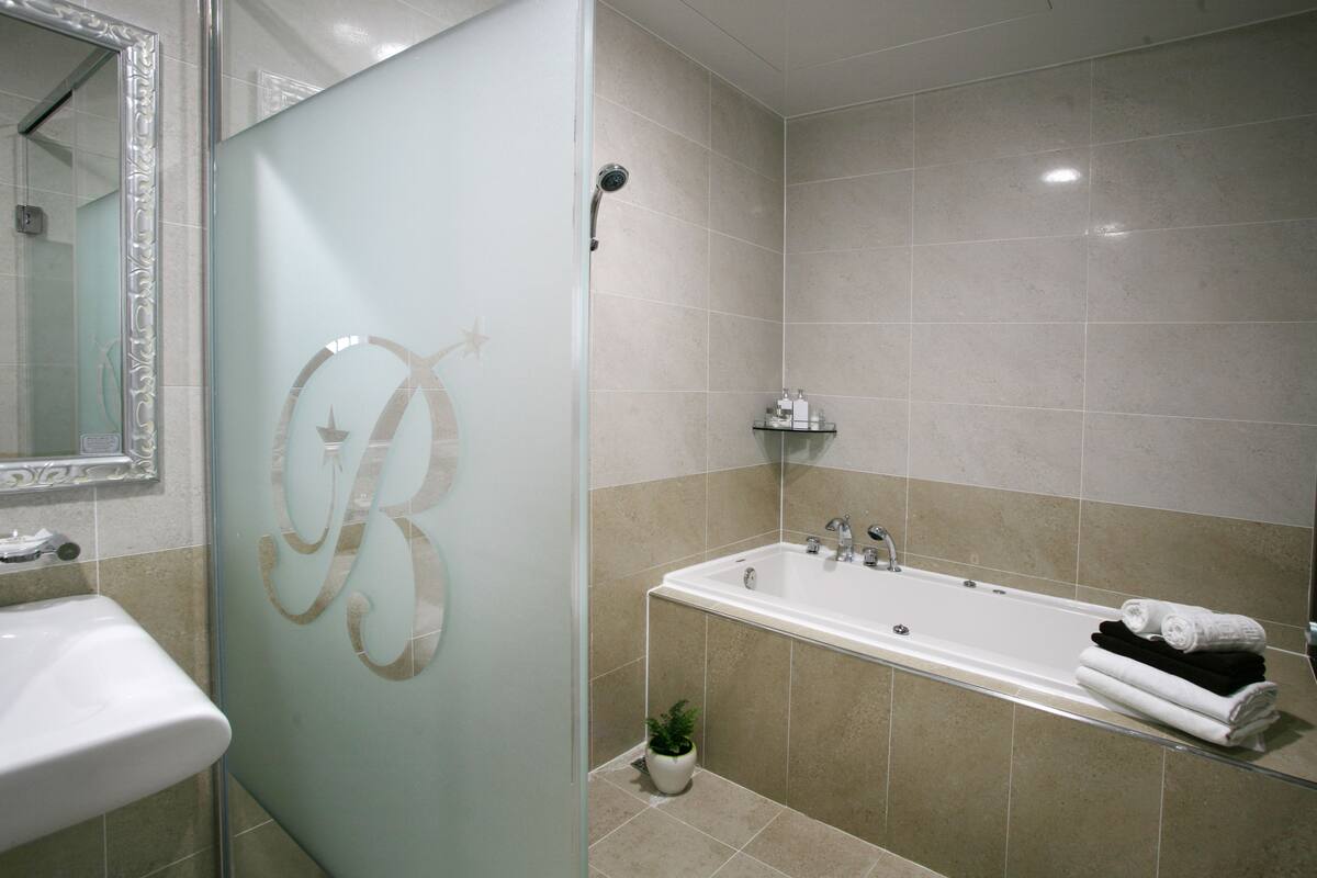 hair dryer, bathrobes, slippers, bidet