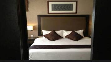 Minibar, desk, blackout curtains, iron/ironing board