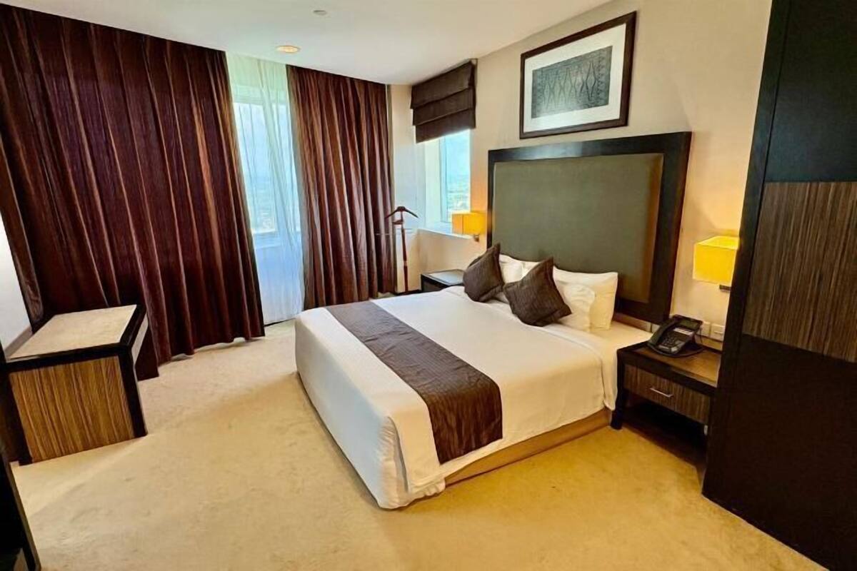 Minibar, desk, blackout drapes, iron/ironing board