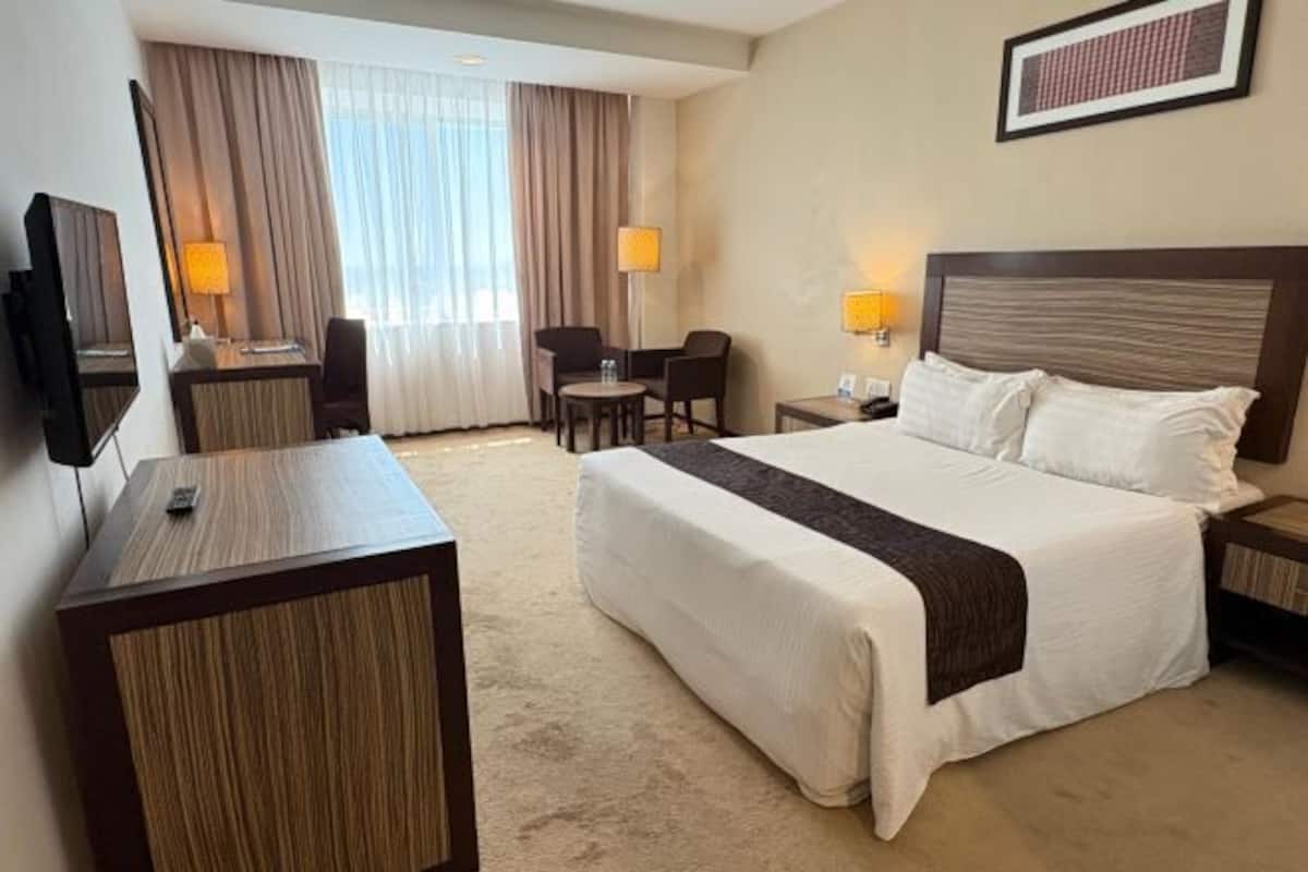 Minibar, desk, blackout drapes, iron/ironing board