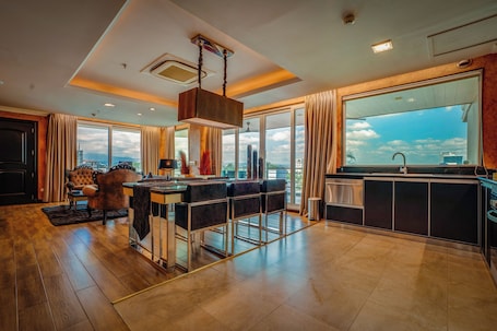 2 Bedroom Executive Suite w/ West Balcony | Living area | 42-inch Smart TV with cable channels, Netflix, streaming services. Fields Plaza Hotel