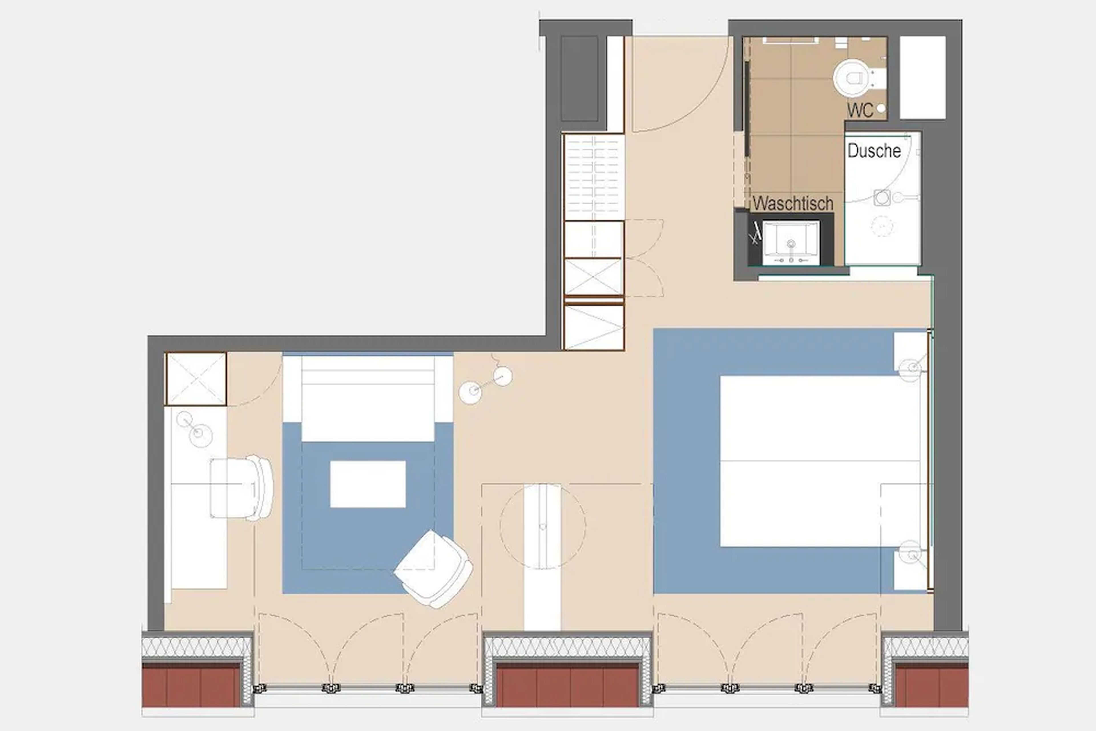 A hotel floor plan with a bedroom, bathroom, and living area.