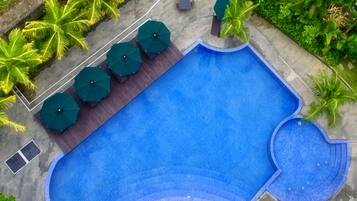 Outdoor pool, open 6:00 AM to 6:00 PM, pool loungers