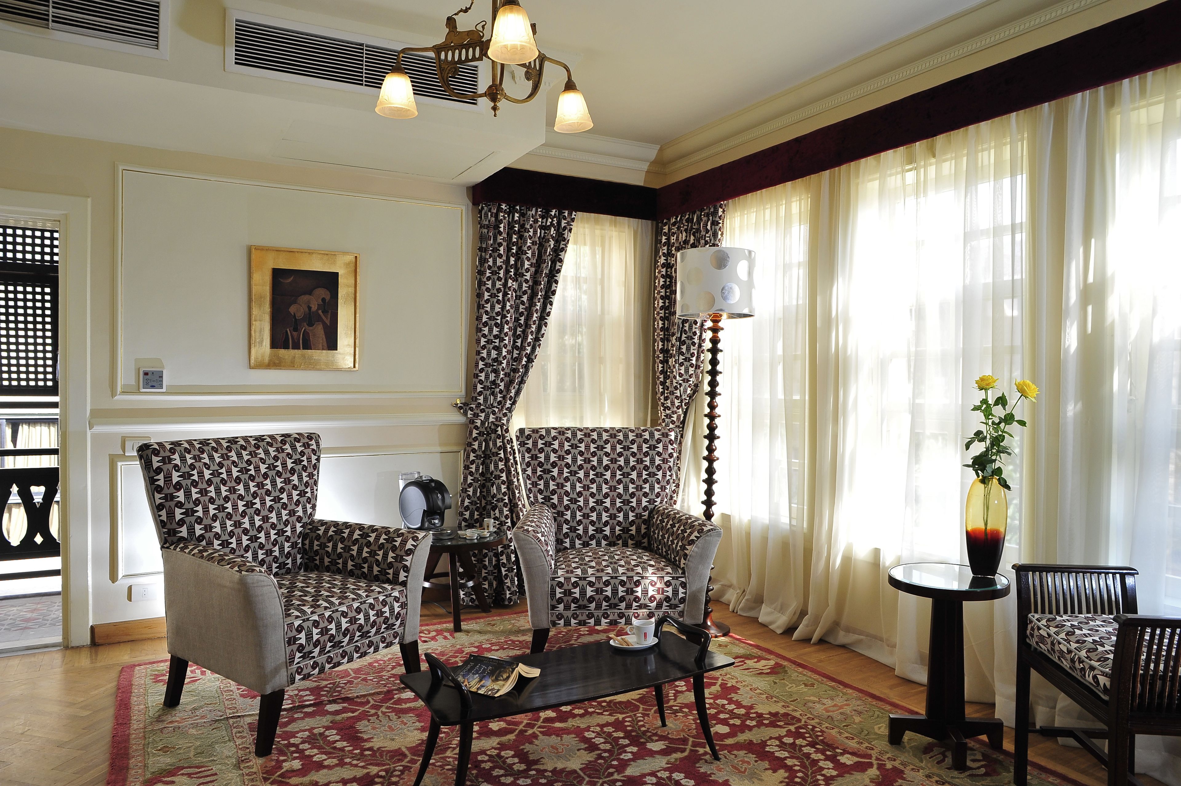 junior suite, garden view, garden area | living area | flat-screen tv