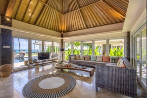 Four Bedroom Beach Front Pool Villa - Sunrise | Living area | 42-inch LCD TV with cable channels - The Royal Purnama Luxury Villas - Adults Only (Sukawati)