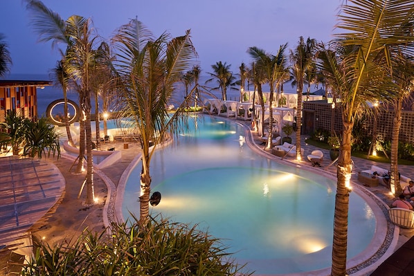 Outdoor pool, open 7:00 AM to 7:00 PM, free cabanas, pool umbrellas