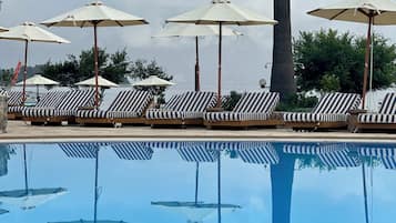 Seasonal outdoor pool, pool umbrellas, pool loungers