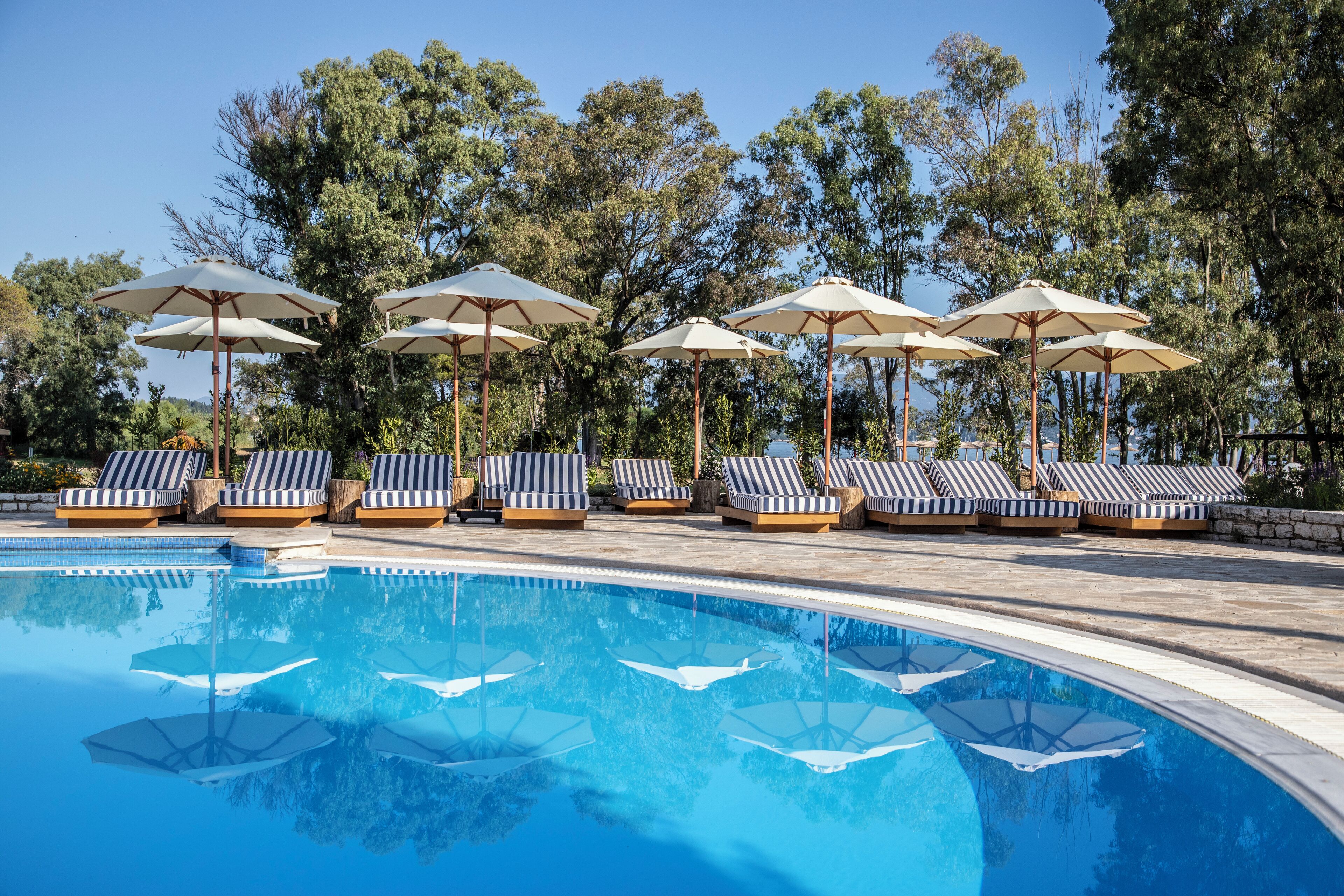 seasonal outdoor pool, pool umbrellas, pool loungers