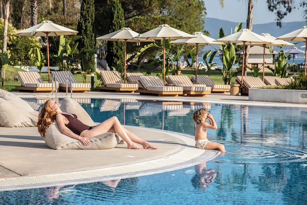 Seasonal outdoor pool, pool umbrellas, pool loungers