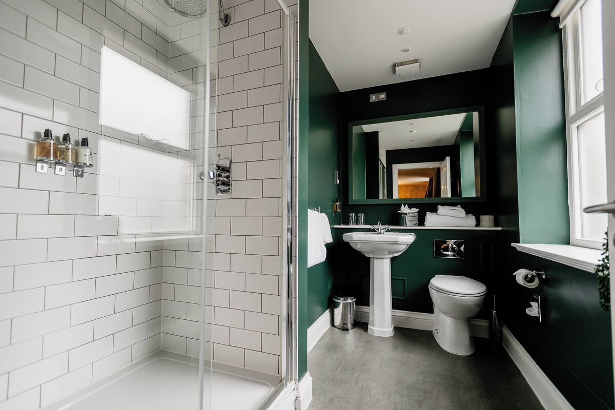 suite | bathroom | shower, designer toiletries, hair dryer, slippers
