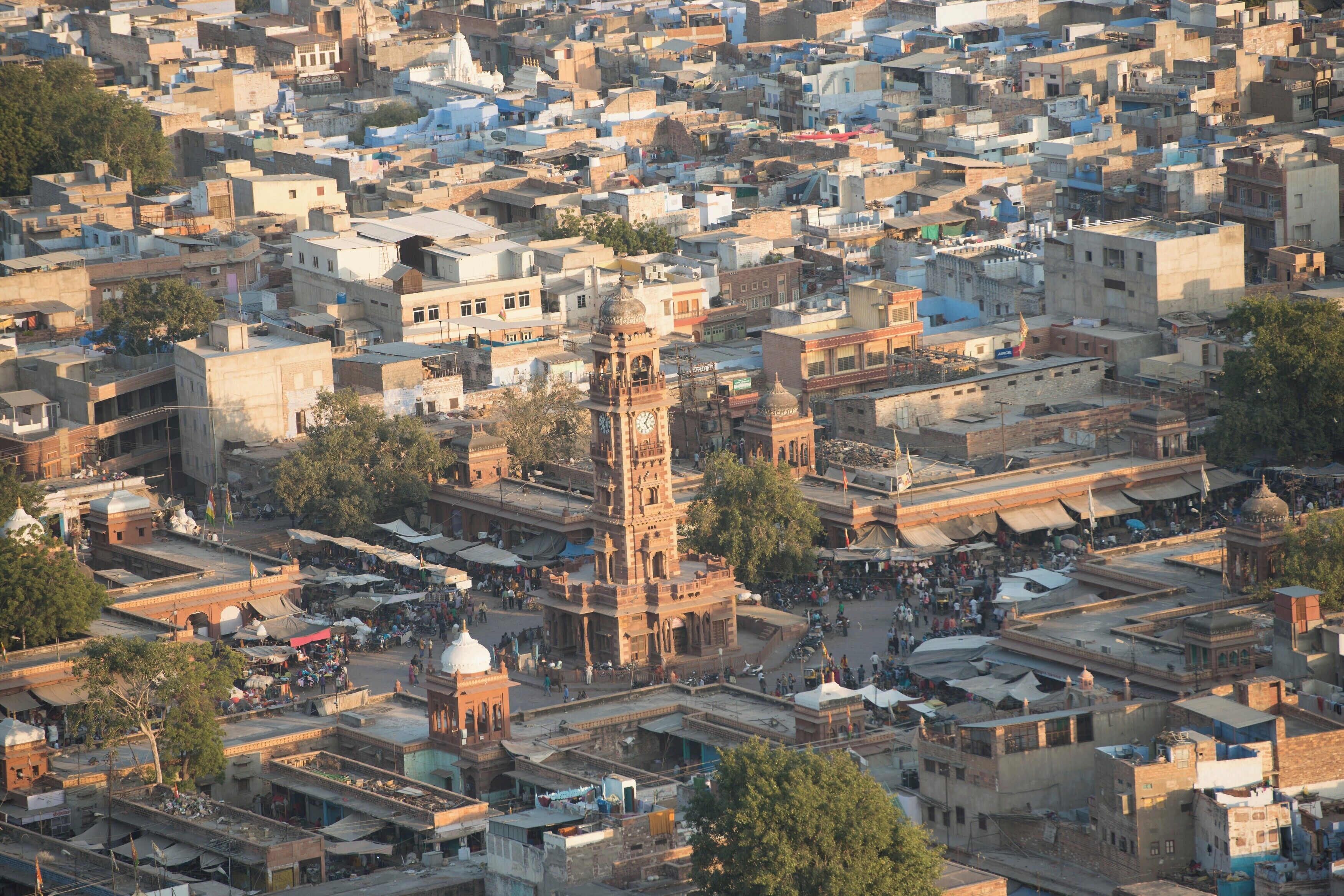A densely packed urban area with historic architecture, including a prominent clock tower.