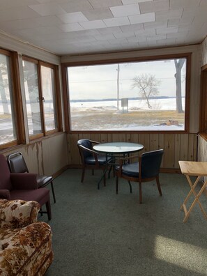 Triple Room, Multiple Beds | In-room dining - Sun 'N Snow Hotel (Cadillac)